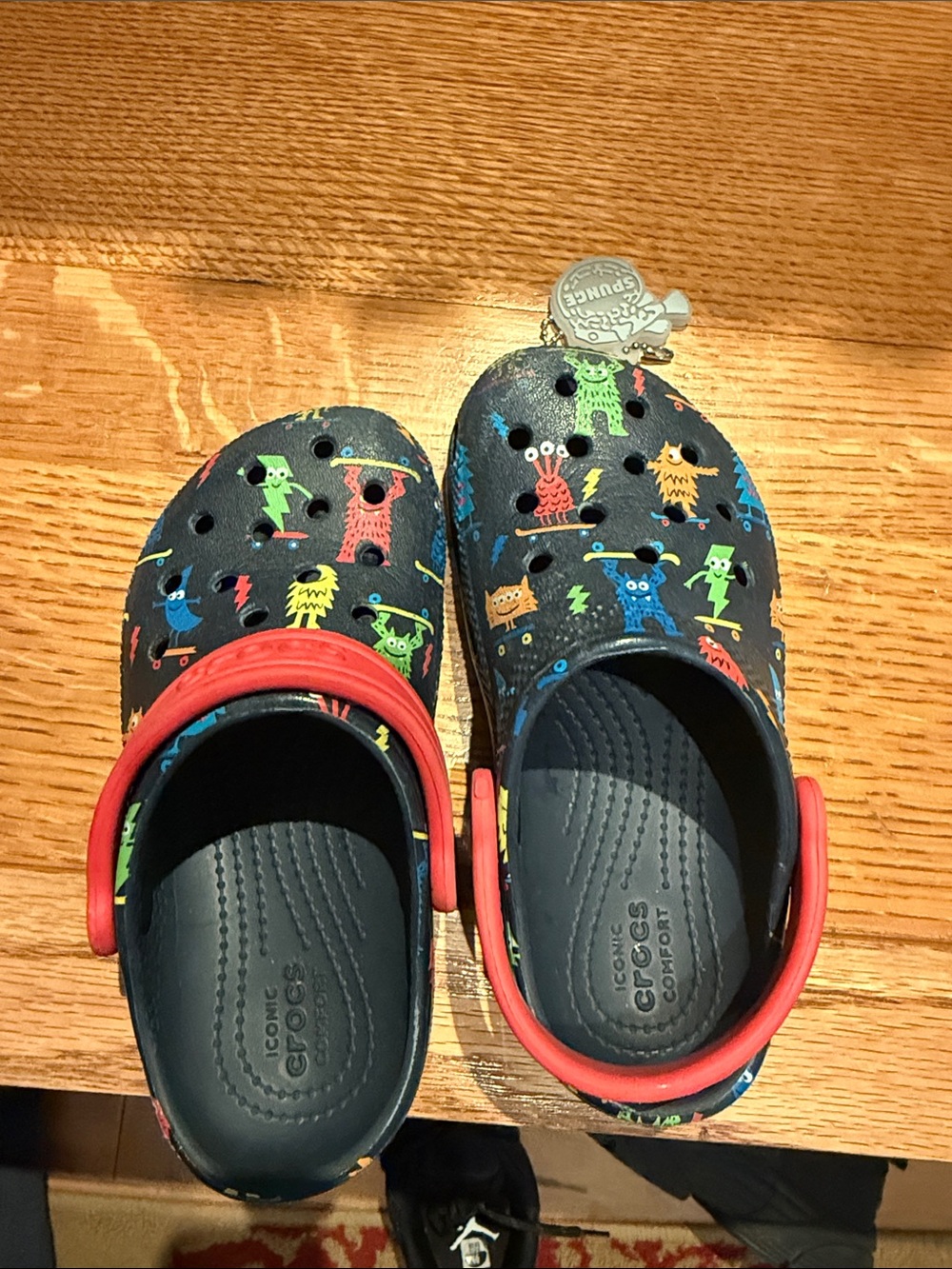 CROCS Kids Navy Clogs with Multicolor Monster Print and Red Heel Strap